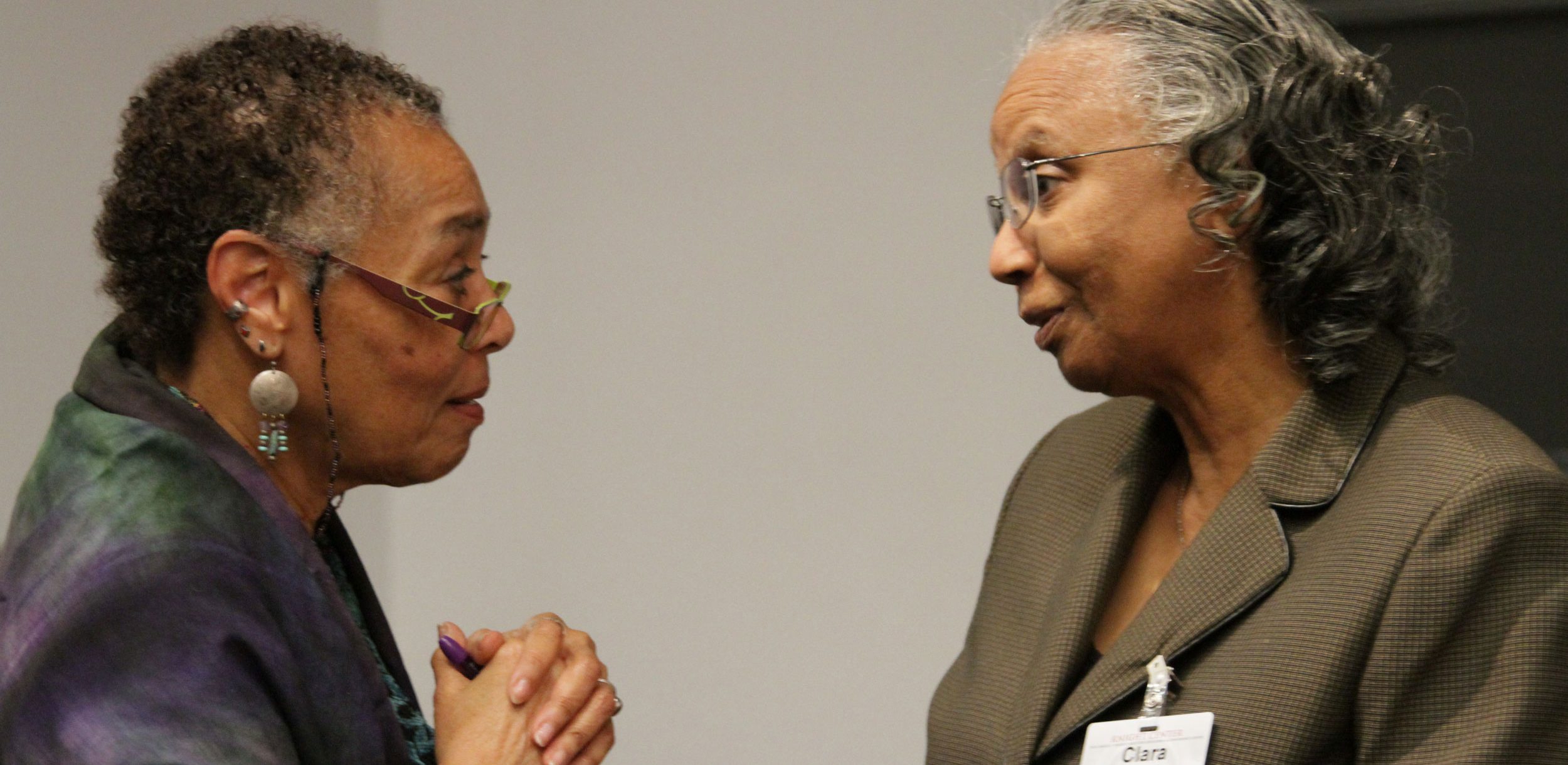 Subject Librarian Clara McLeod speaks with Judy Richardson during the Scarred Justice event.