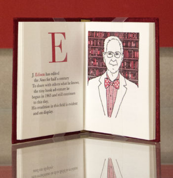 The book is open on the letter "E" and showcases a drawing of Julian Edison.