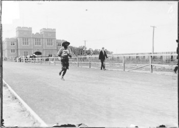 Image of James Lightbody on a running track. 