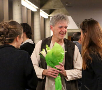 Robert Henke accepting flowers from two students at the closing reception for Krapp's Last Tape, Beckett's one-man, one-act play. 