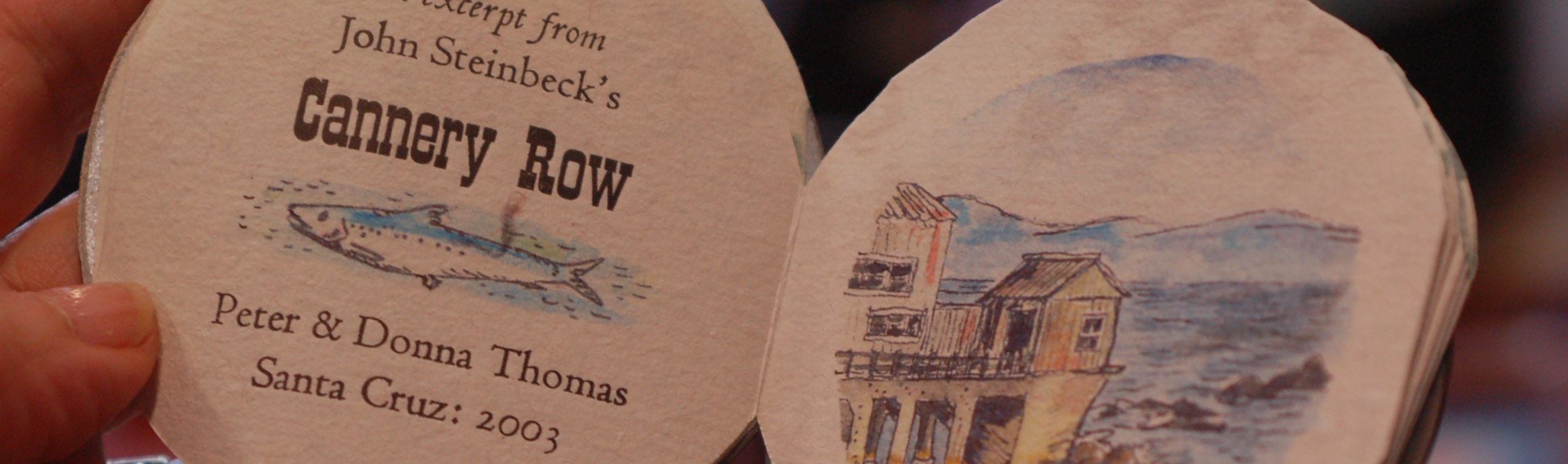 An illustrated, circular miniature book of an excerpt from John Steinbeck's Cannery Row, drawn and arranged by Peter and Donna Thomas, Santa Cruz: 2003.