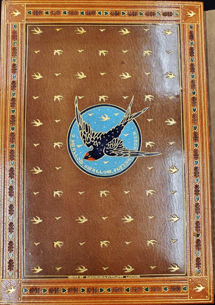 The second of two endpapers for The Princess also has outlines of swallows in flight stamped throughout the leather. In the center of the endpaper is a larger, more detailed swallow flying on a blue sky backdrop. Text beneath the detailed, center swallow reads "O swallow, swallow, flying south."