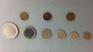 Planchets are the blank, cut metal coins before stamped with a coinage die demarcating their value as money or currency. 