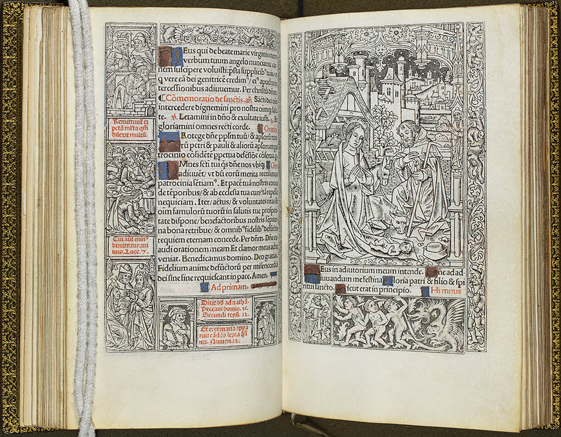 A two-page spread of The Book of Hours. One page has text, some of which is written in red, and the other boasts a black-and-white nativity scene with Joseph and Mary accompanied by a cow kneeling in front of the infant Jesus with an intricately detailed outline of the city skyline behind them.