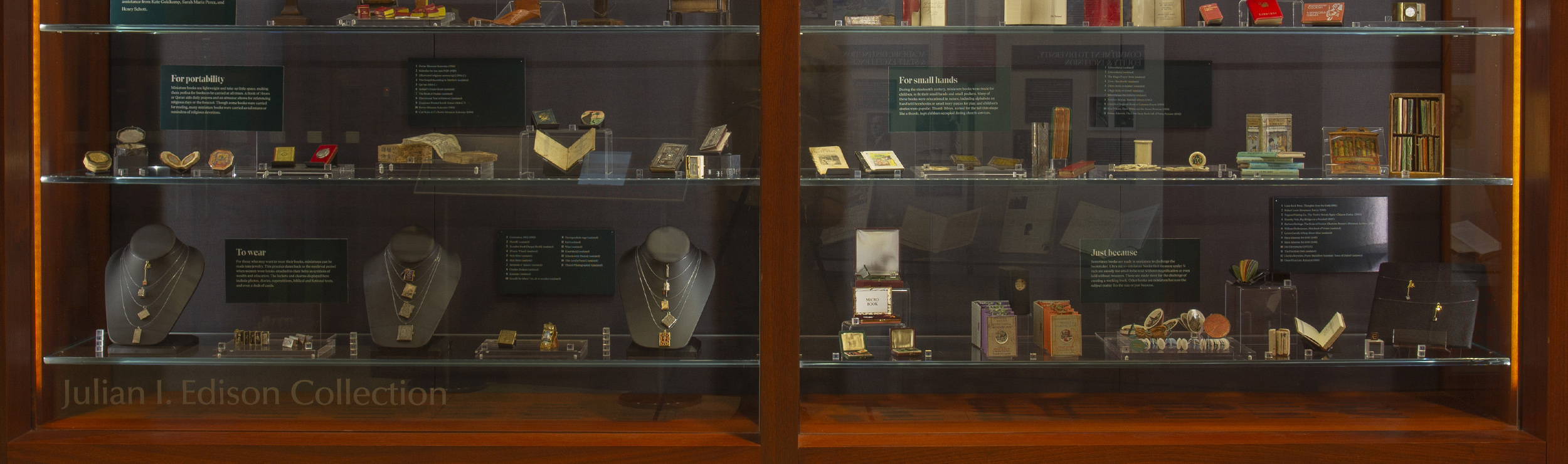 A photo of the exhibition case displaying the various miniature books featured in the physical exhibition for Why So Small?