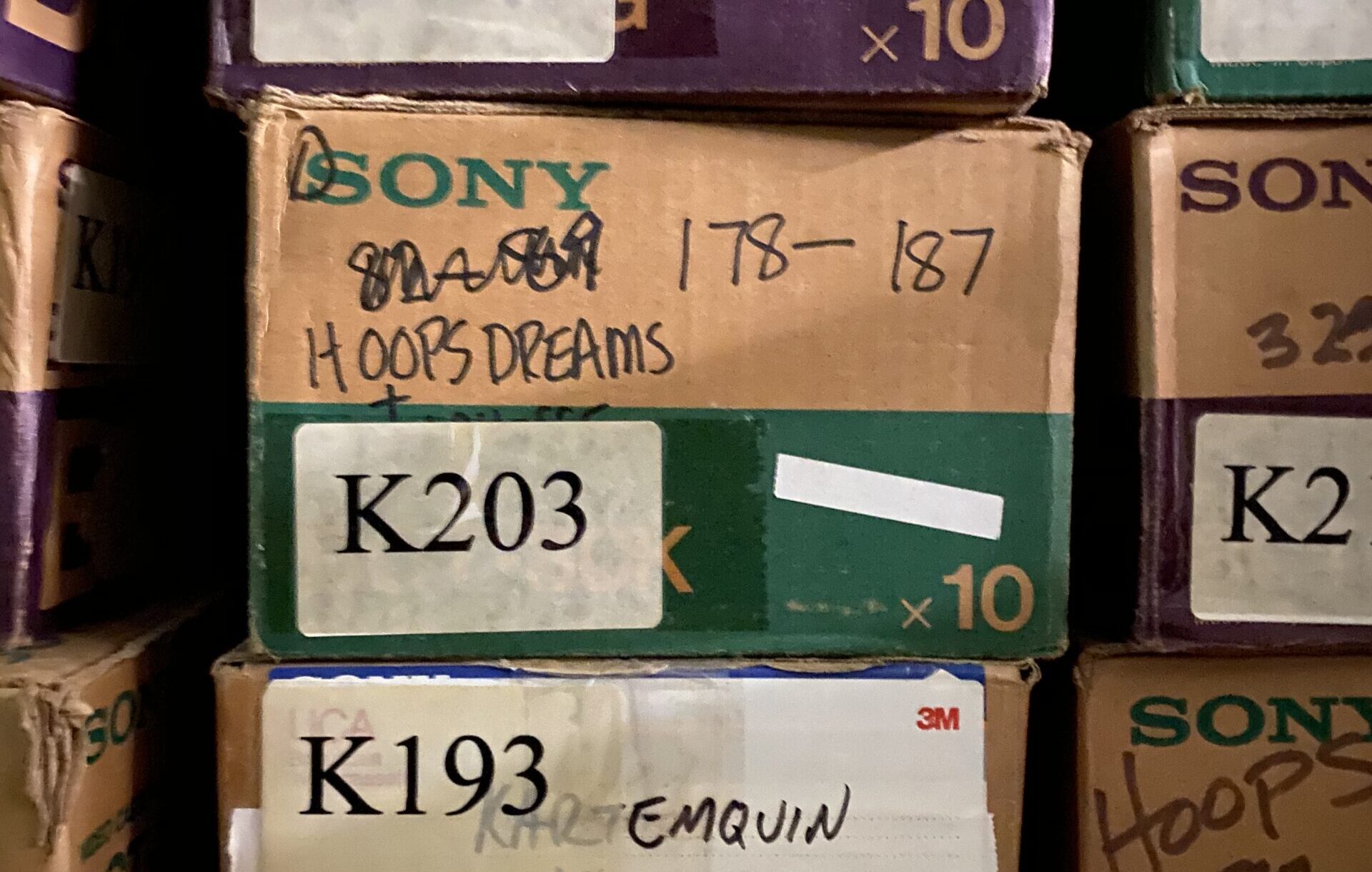 Small boxes of Sony reel film from the Kartemquin Collection, most with labels reading "Hoops" or "Hoops Dreams."