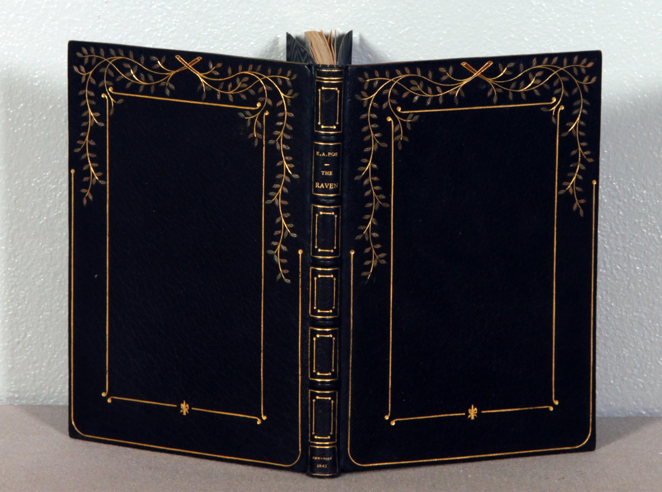Embossed leather covers (front and back) of an open book.