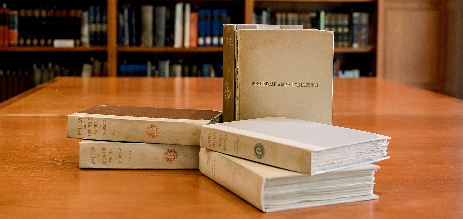 A six volume collection including books such as "Some Edgar Allen Poe Letters," volumes one and two of Walden by Thoreau, and works of Charles Dickens.