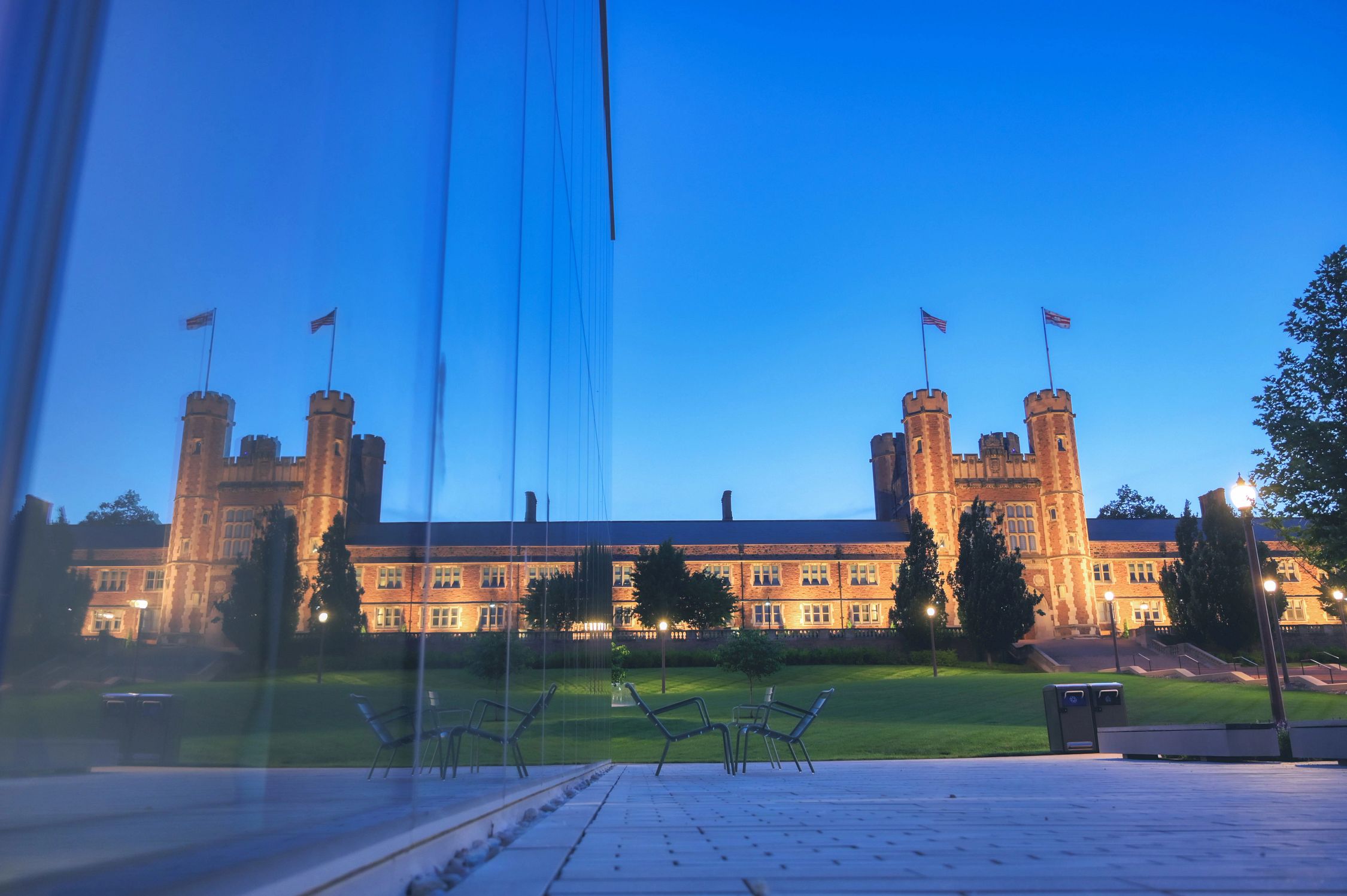A photo of Brookings Hall and its reflection in the glass of the Kemper Art Museum.