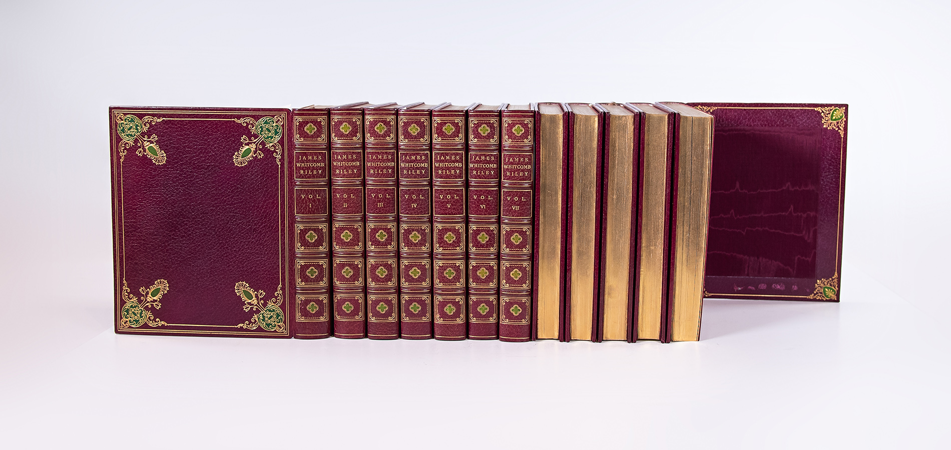 A collection of leather bound volumes with gilded edges.