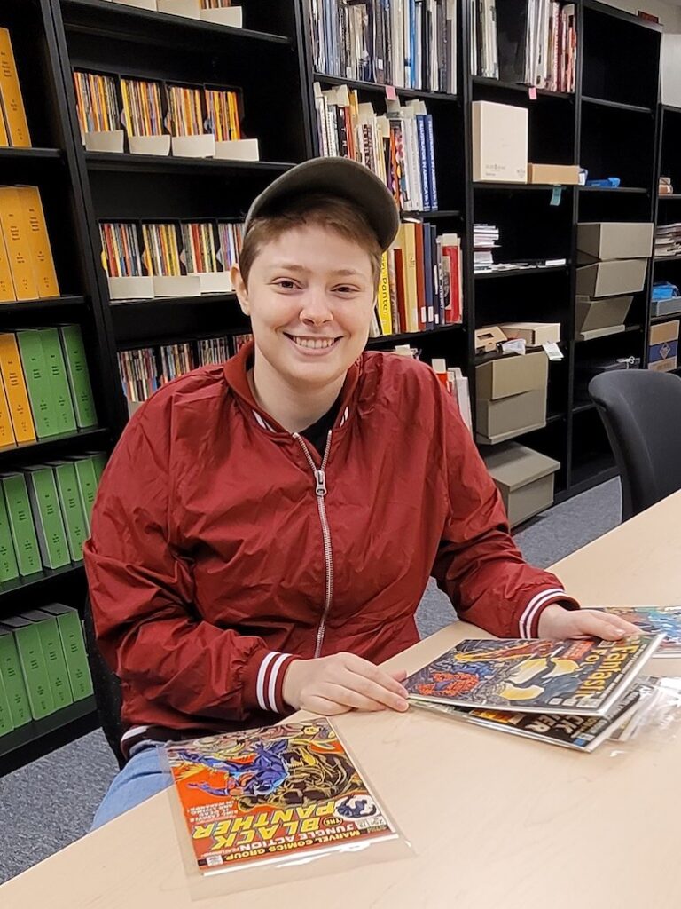 MGHL intern with the comic collection
