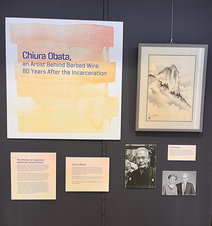 The title and descriptive cards for the Chiura Obata exhibition on display outside of the Julian Edison Department of Special Collections. The title card reads "Chiura Obata, an Artist Behind Barbed Wire: 80 Years After the Incarceration."
