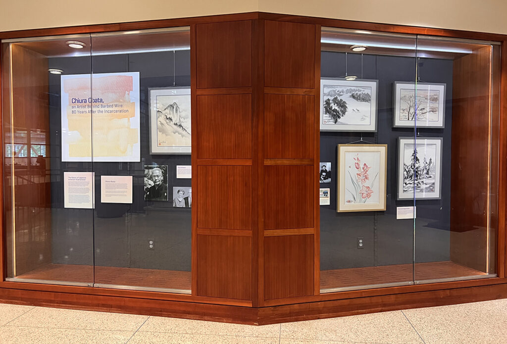 The full Chiura Obata painting exhibitions in the display case outside of the Julian Edison Department of Special Collections.