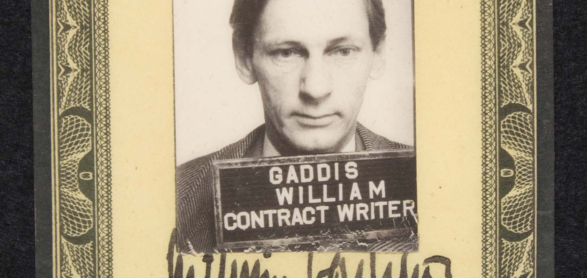 A close up of a US Army Pictorial Center ID card for William Gaddis. The card identifies Gaddis as a contract writer.