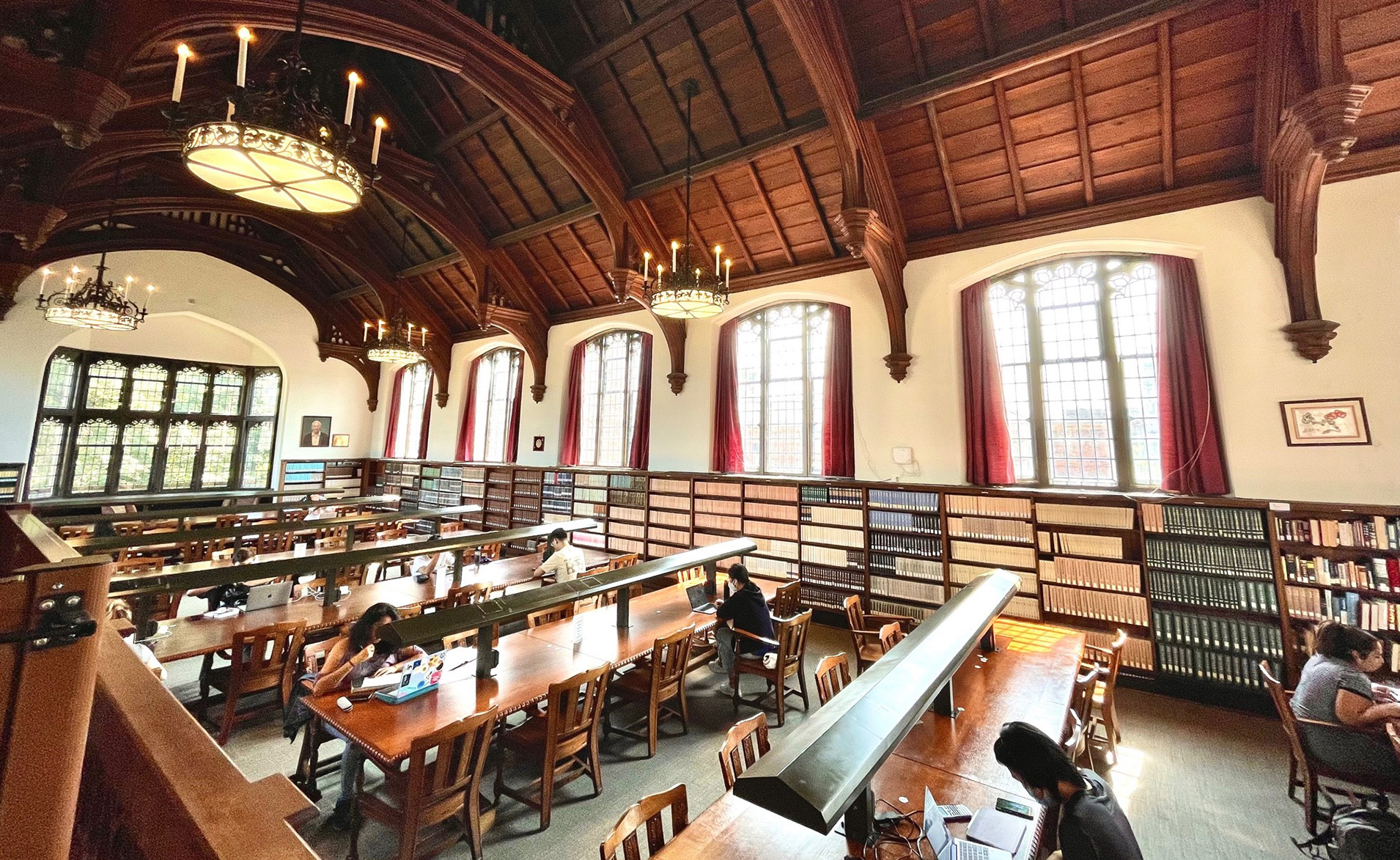 Students studying at the tables in the East Asian Library.