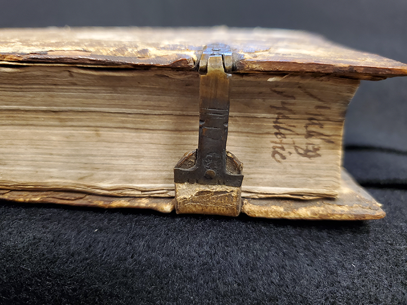 Book fore edge with metal strap