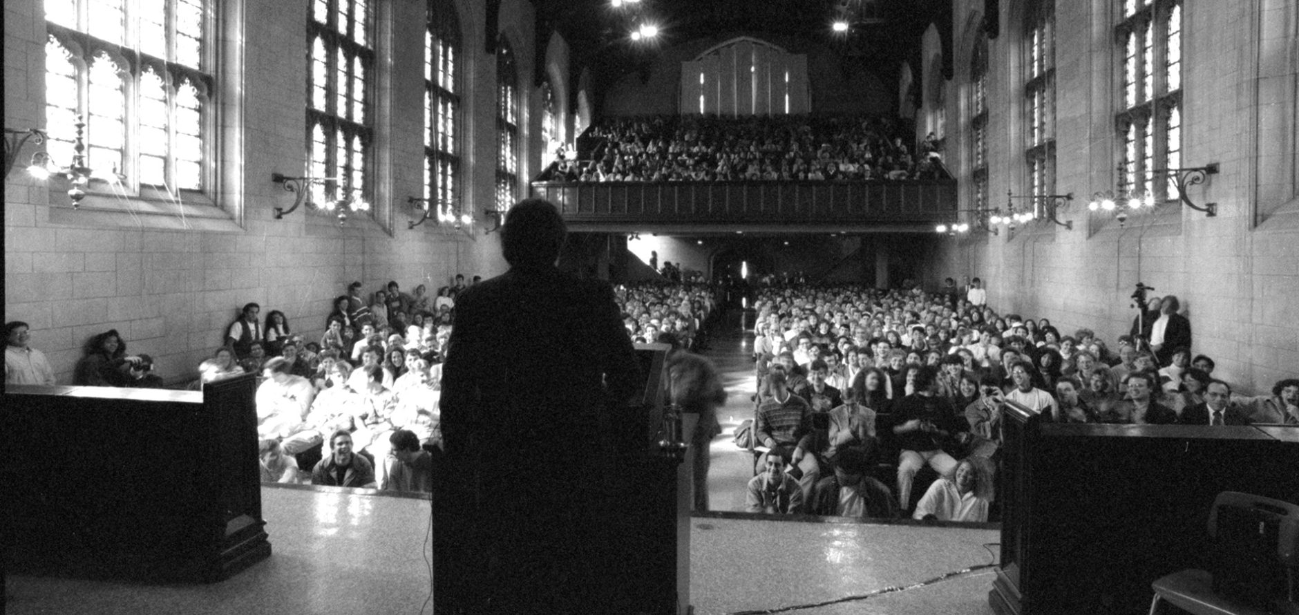 Harold Ramis giving a speech at a packed Graham Chapel in 1990