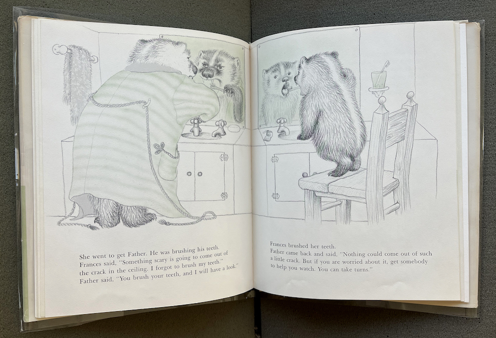 Inside pages showing pencil drawings of a large bear and a bear cub brushing their teeth in a bathroom with mirrors and wash basins
