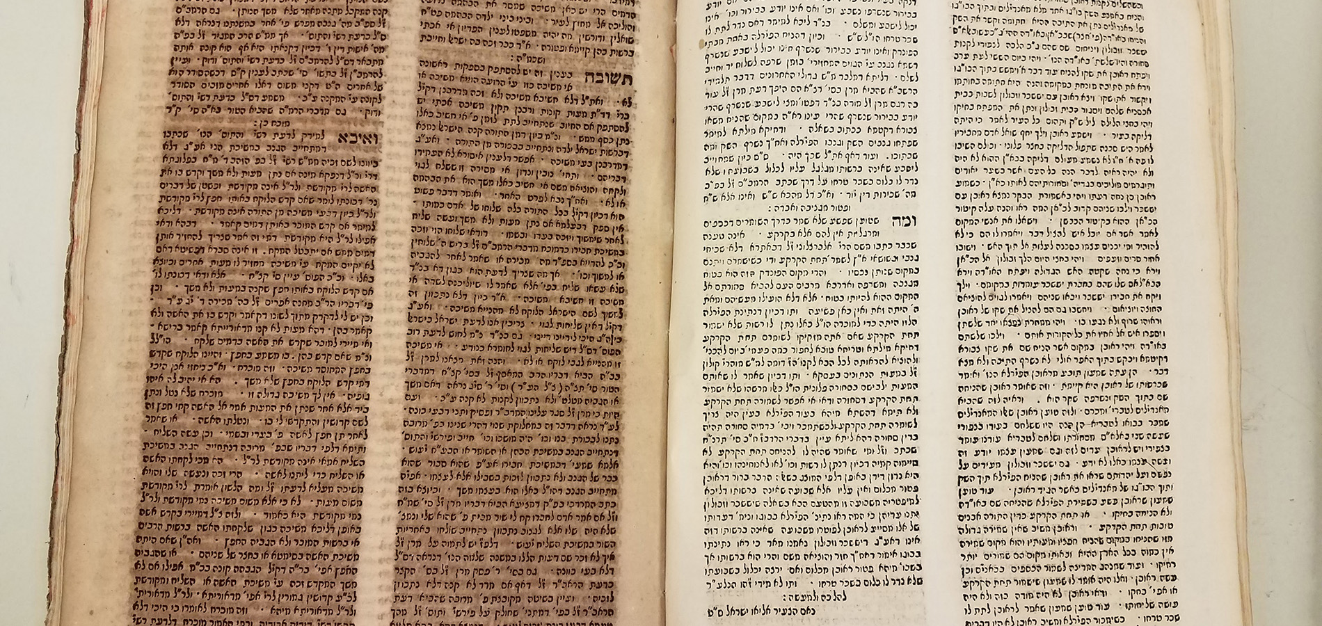 A book is open to display two pages - one is near illegible due to light damage while the other, protected from the light, is perfectly crisp and readable.