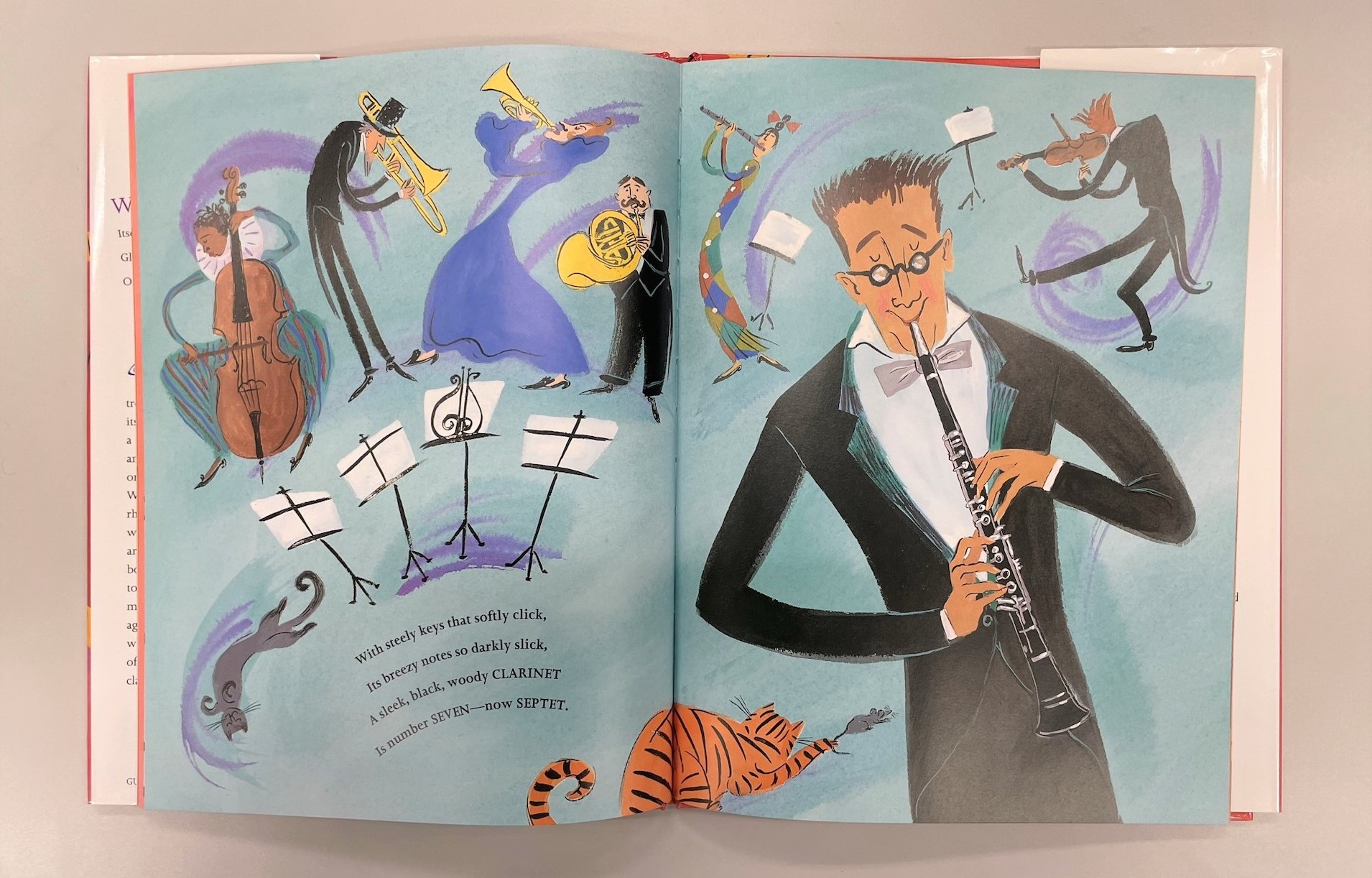 Illustration of people playing instruments, playful cats and an accompanying poem on the page.