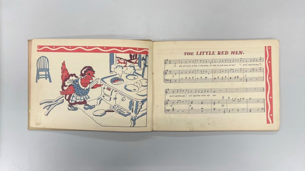The Little Hen music on the right page with an illustration of a red hen in an apron in front of a a kitchen stove.