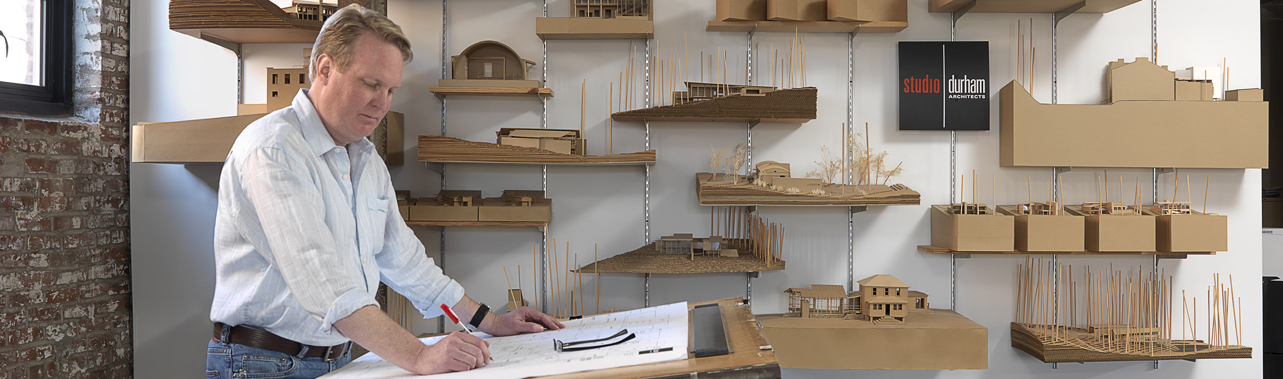 Architect and alumnus Phil Durham sketching a design in his studio.