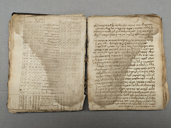 The image shows a Hebrew manuscript that is heavily water damaged.