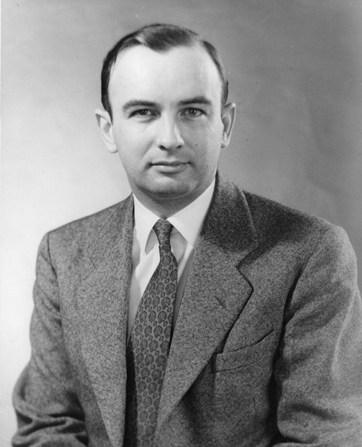 Black and white photo of architect Joseph Murphy in a suit and tie.