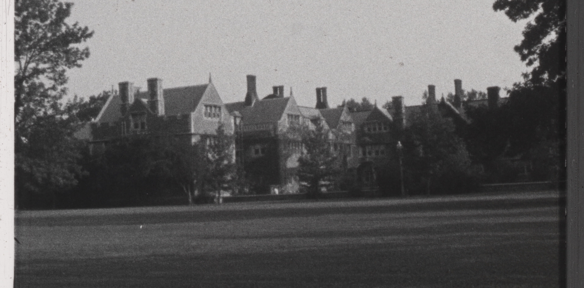 B&W photo of campus grounds and buildings