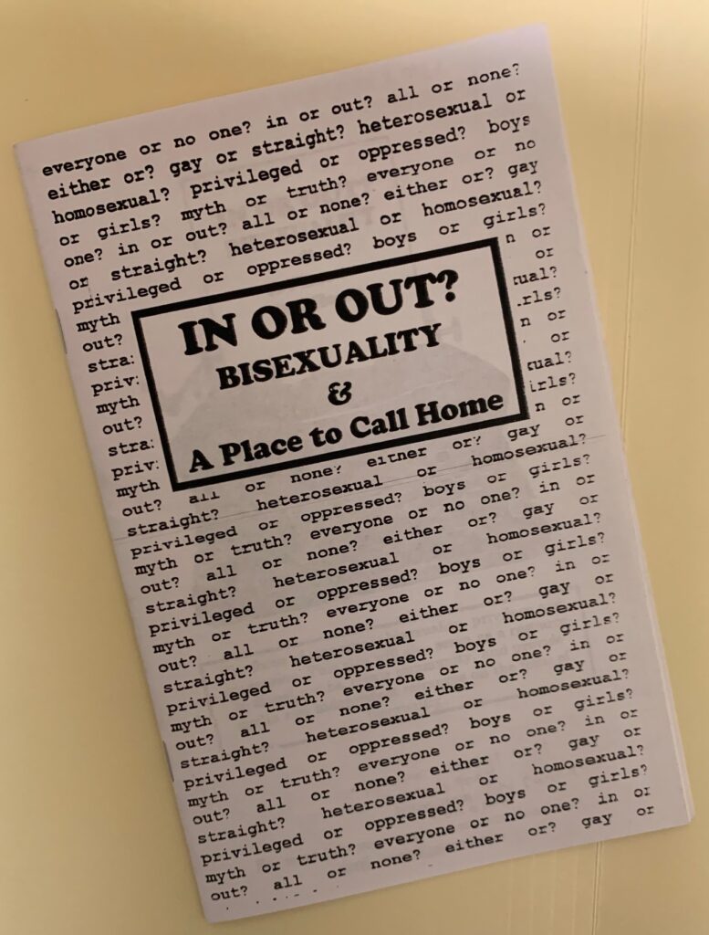 A folded piece of paper with typed writing in black ink.