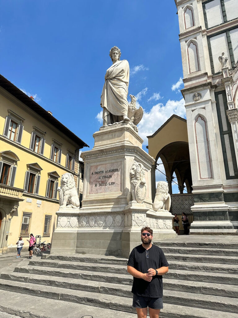 Me with the statue of Dante in Florence’s Piazza Santa Croce