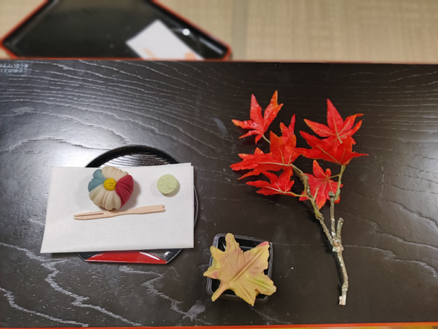 Red and yellow maple leaves on a table