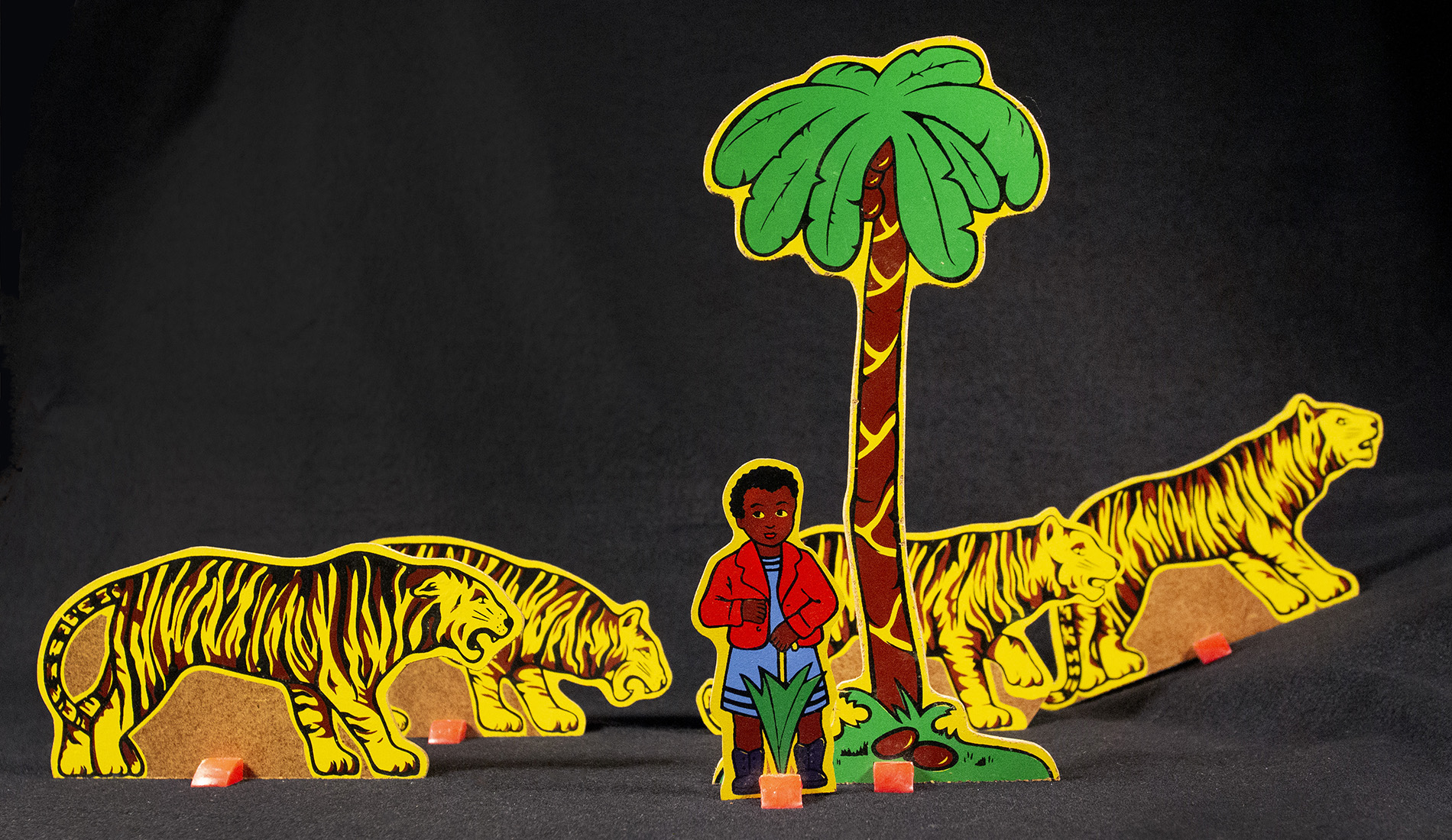 Paper cutouts of Sambo with four tigers.