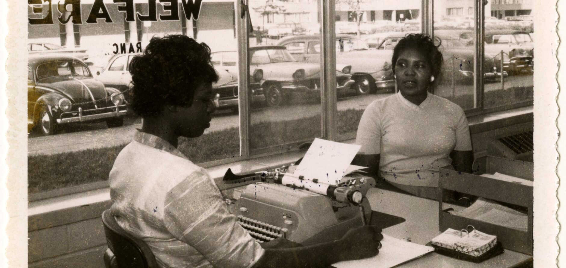 Two women in the Division of Welfare Office across from the Pruitt-Igoe public housing project