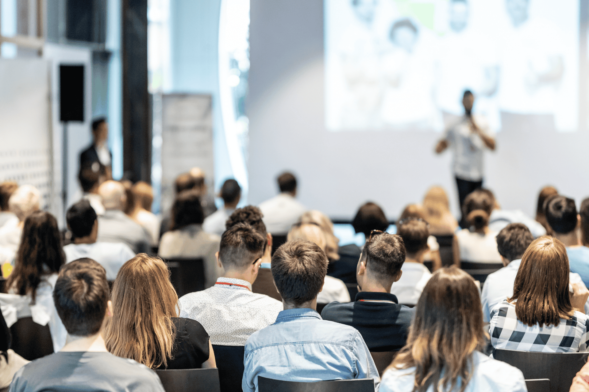 Stock photo of people attending a business presentation