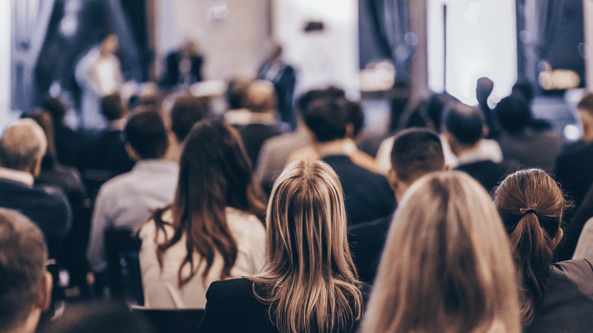 Stock photo of audience listening to a lecture